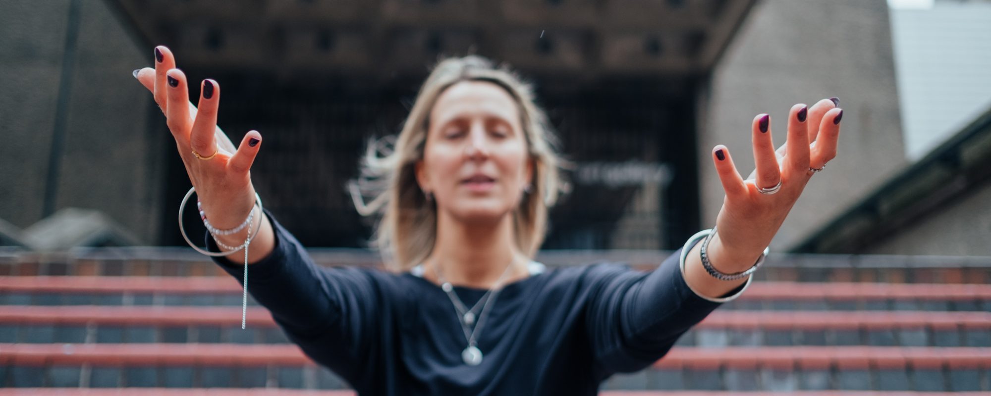 Martha wide arm on steps yoga pose photography at The Barbican