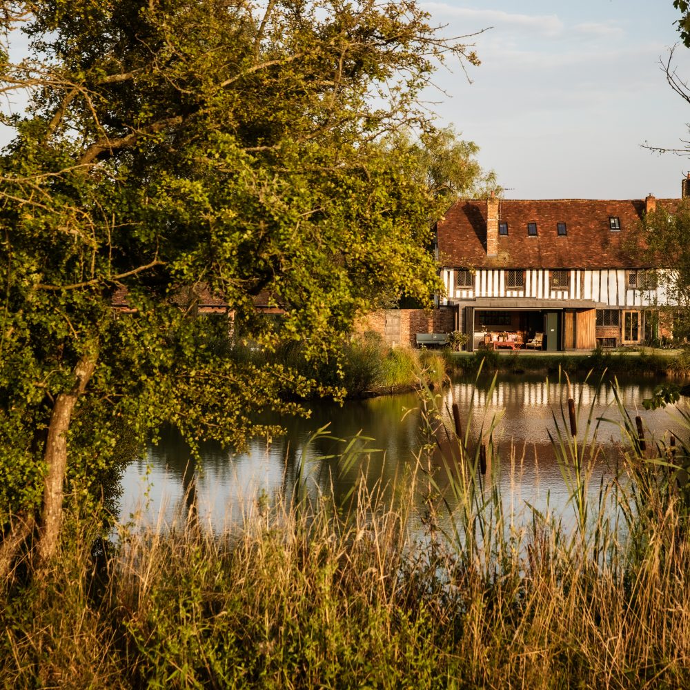 Whitfield House viewed across the lake in the gardens.